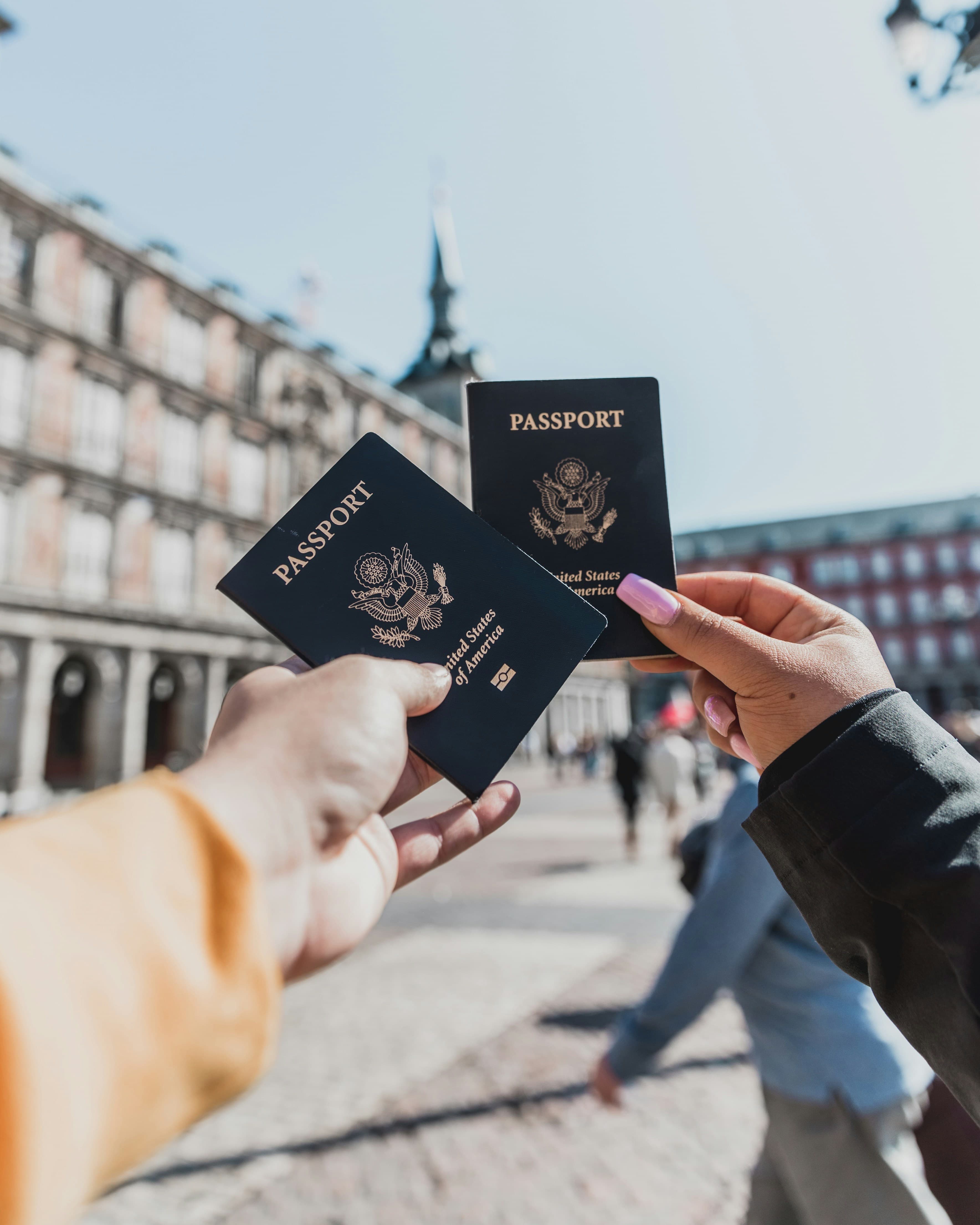 Travelers holding passports
